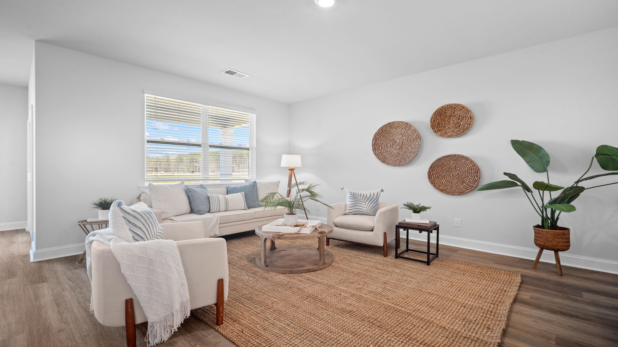 Living area of home decorated with seating and tables