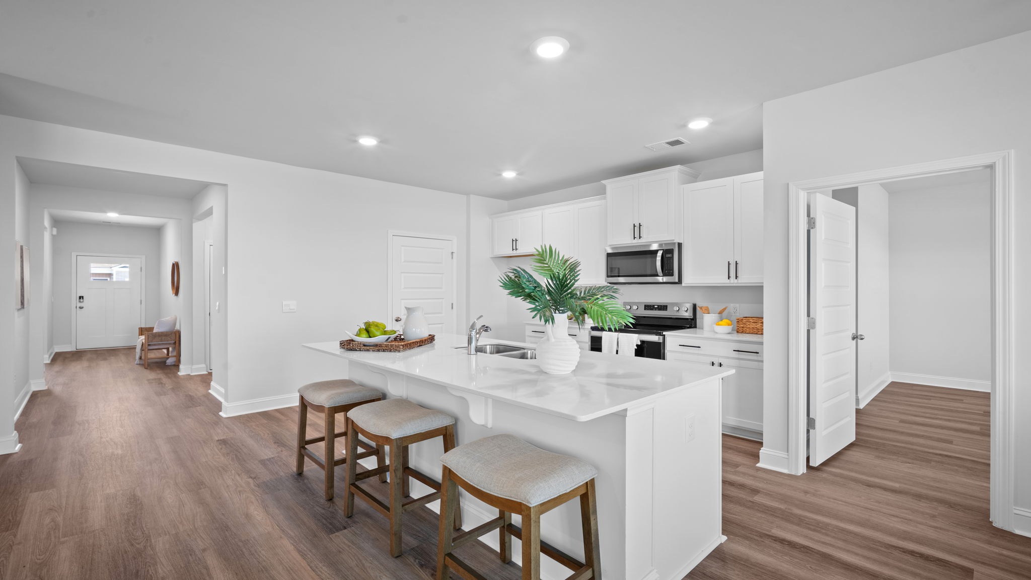 Kitchen with white countertops.