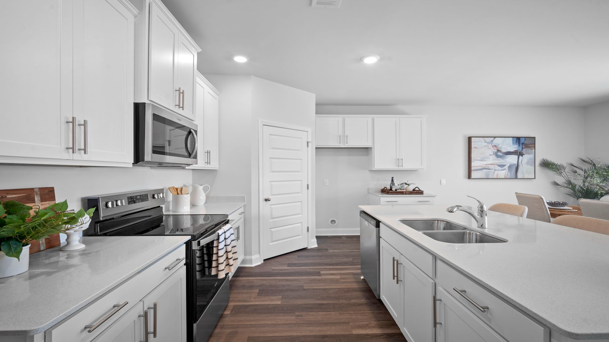Kitchen walkway with counters on both sides
