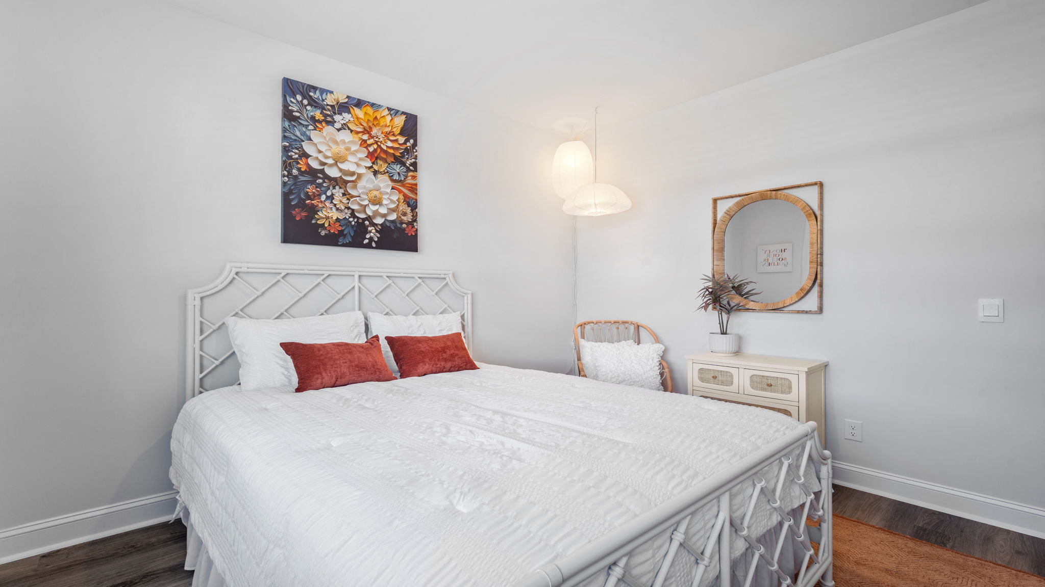 Gust bedroom decorated with a bed and side table