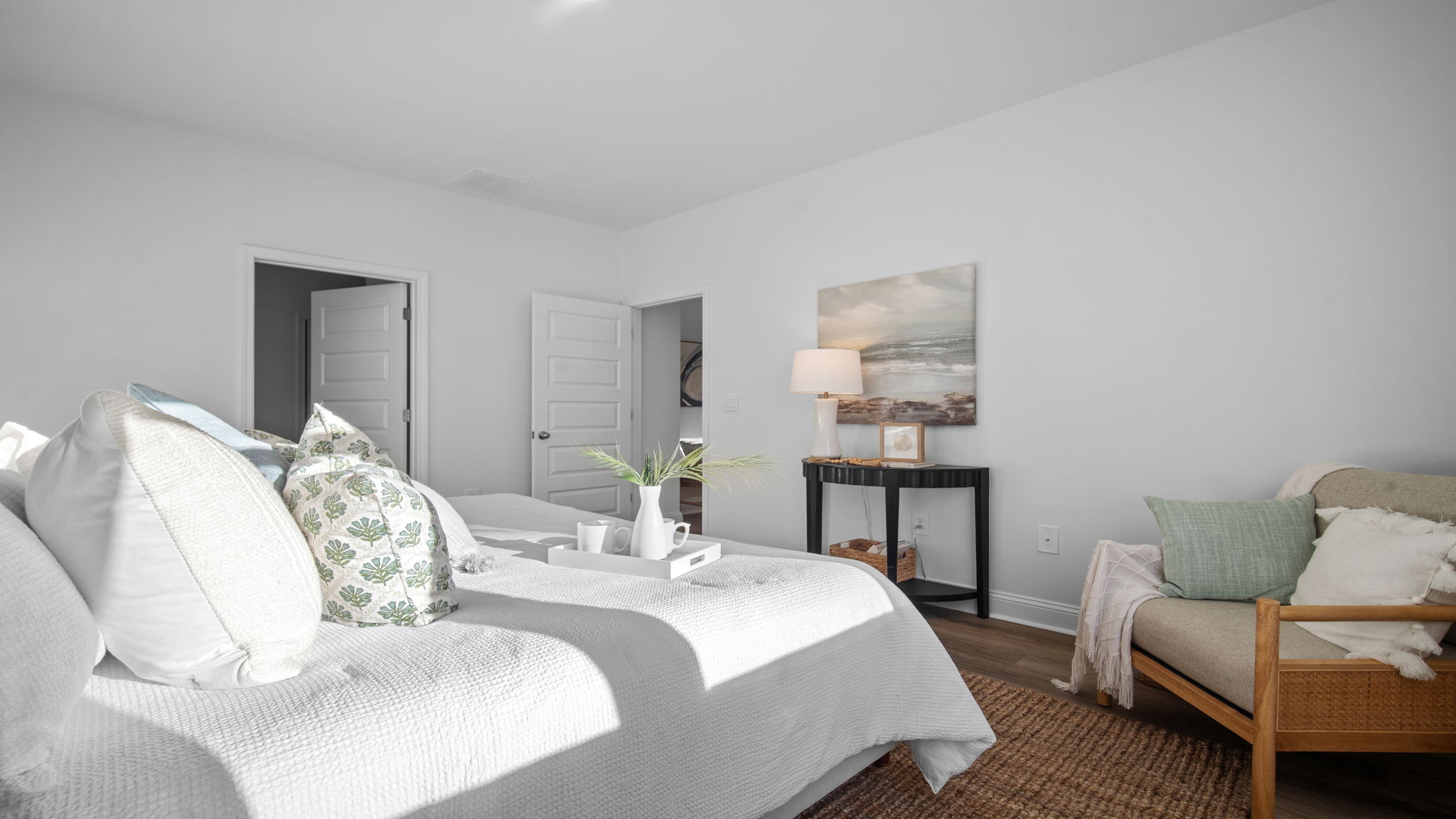 Private primary bedroom suite in the Cali floor plan at Rice Hope featuring a spacious layout, large walk-in closet, and relaxing owner's retreat.