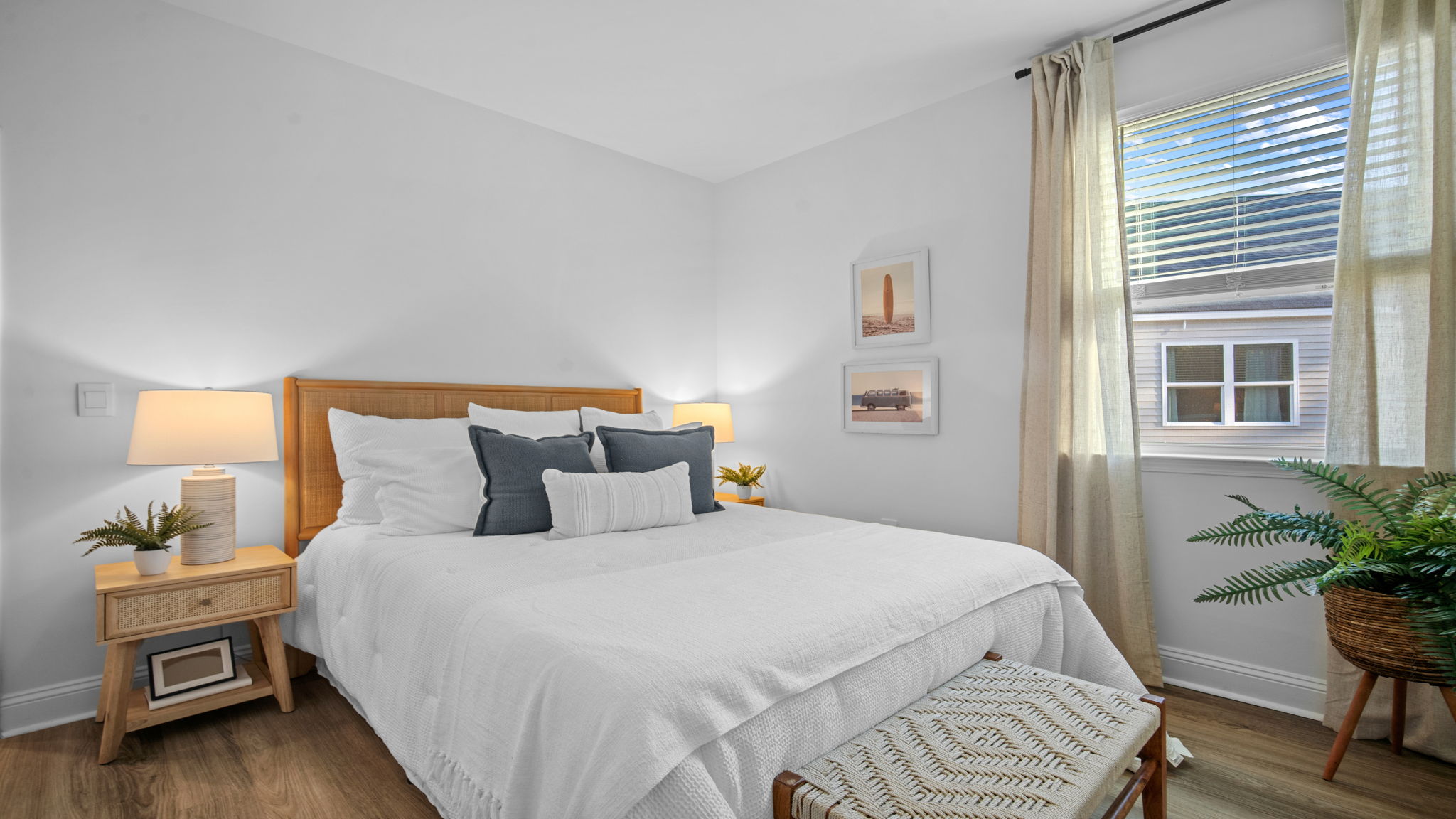 Comfortable guest bedroom in the Cali home featuring convenient access to the hall bathroom and laundry room.