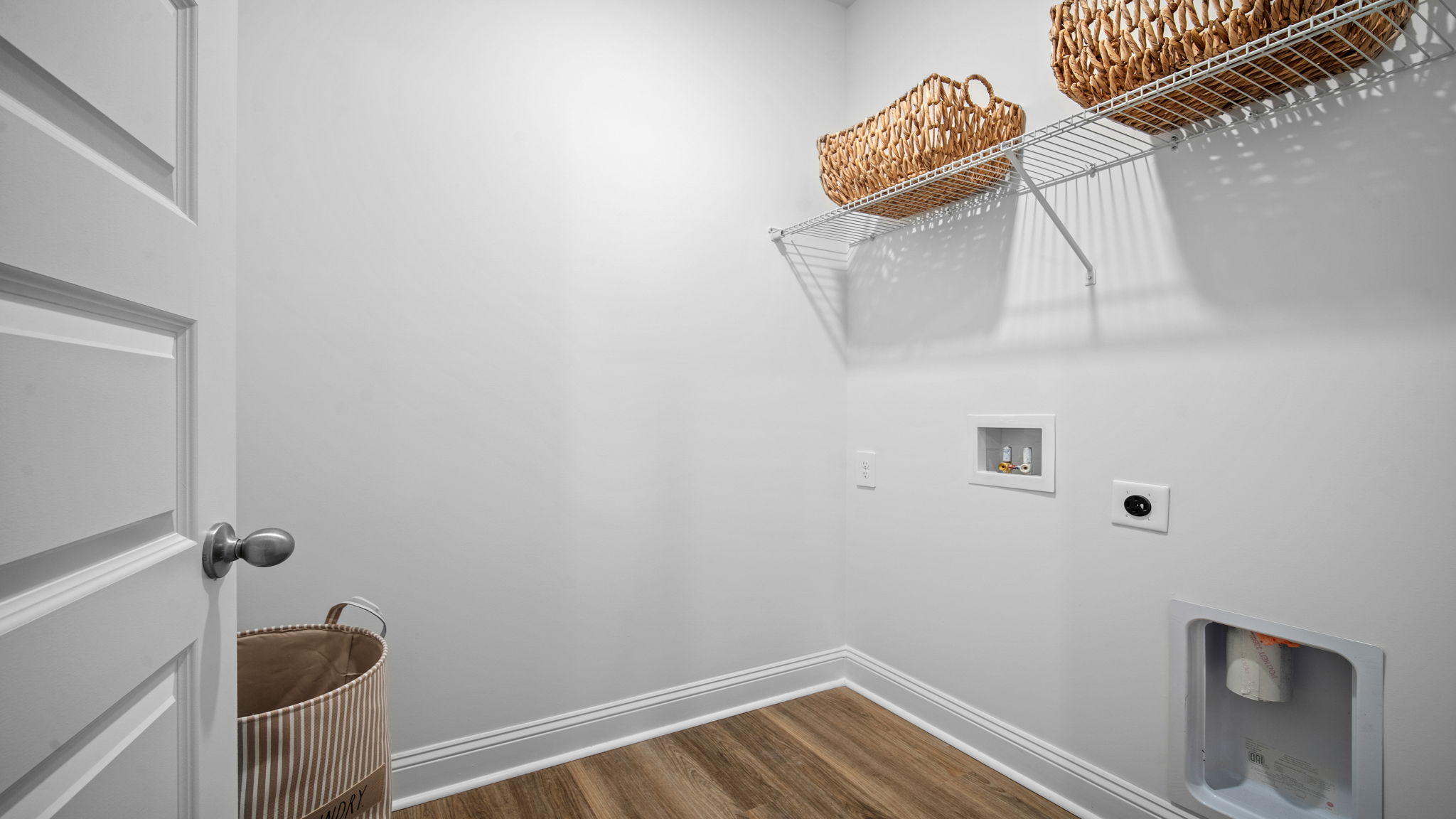 Functional laundry room in the Cali floor plan conveniently located near secondary bedrooms for easy household chores.