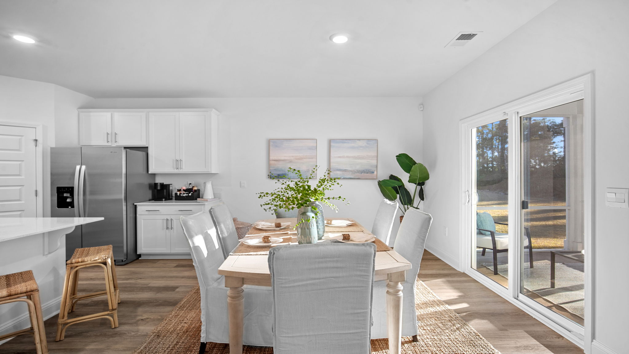 Bright dining area in the Cali floor plan seamlessly connected to the kitchen and family room, perfect for entertaining and everyday meals.