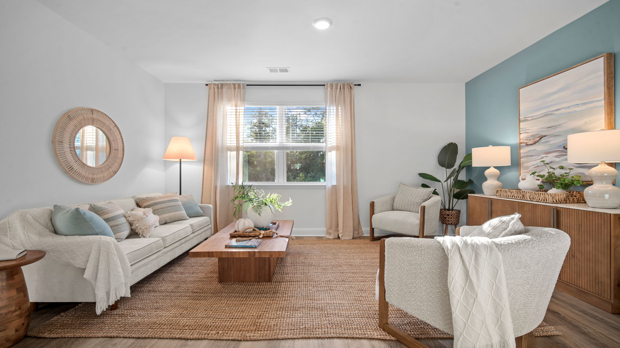 Large living room in the Cali home at Rice Hope designed for comfortable everyday living and entertaining guests.