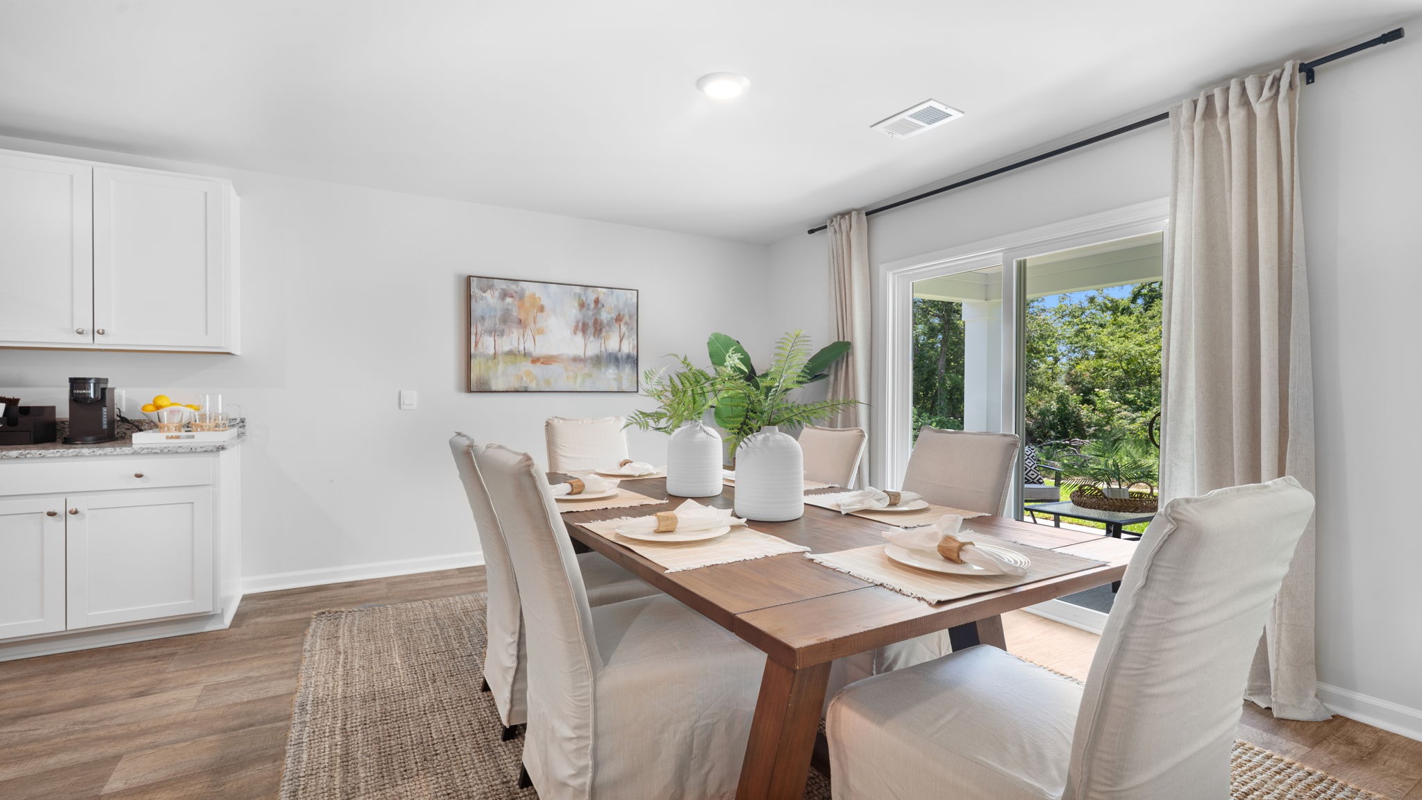 Spacious dining room in the Cali floorplan featuring open-concept design, easy access to the kitchen, and the perfect setting for family meals and special occasions.