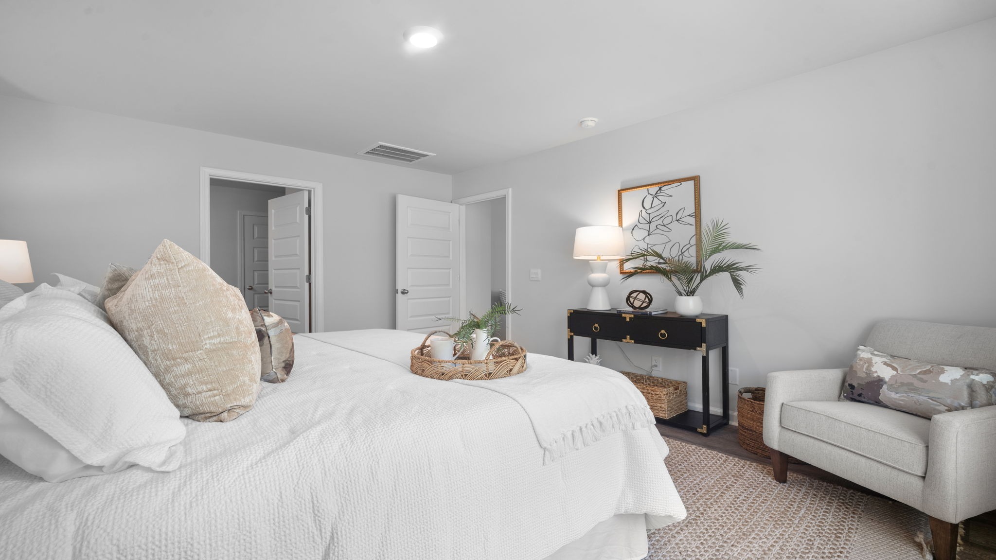 Luxurious owner's suite in the Rice Hope Cali home featuring generous square footage, natural light, and convenient access to a spa-inspired ensuite bathroom.