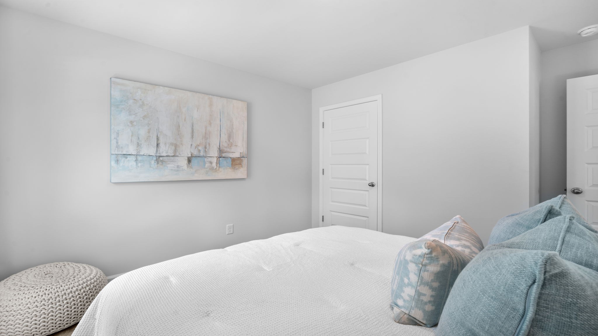 Bright secondary bedroom in the Rice Hope Cali home offering modern comfort, ample closet space, and a thoughtfully designed layout.