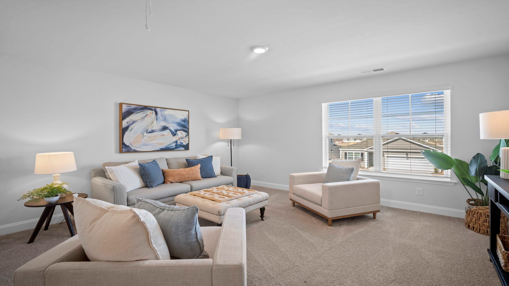 Upstairs living room decorated with seating