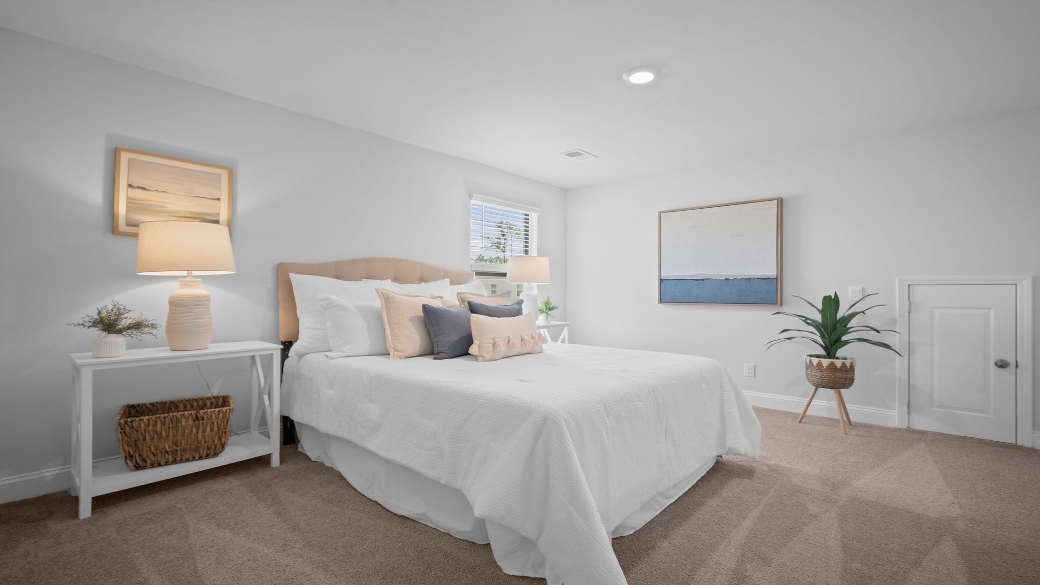 Guest bedroom with a bed and side table