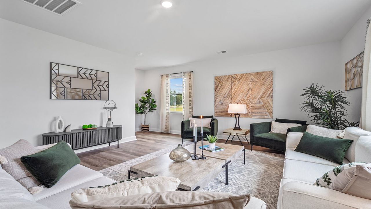 Living room with a couch and chairs