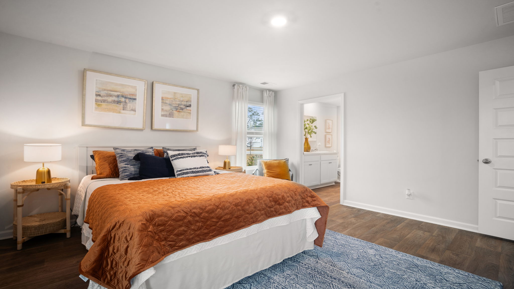 Primary bedroom view of the bed and a side table