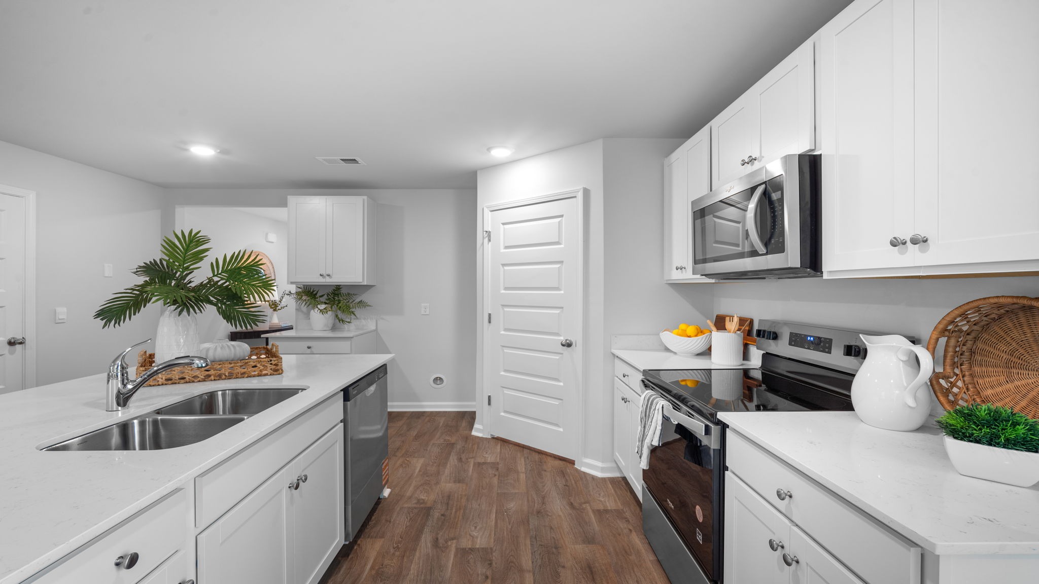 Kitchen walkway with counters on both sides