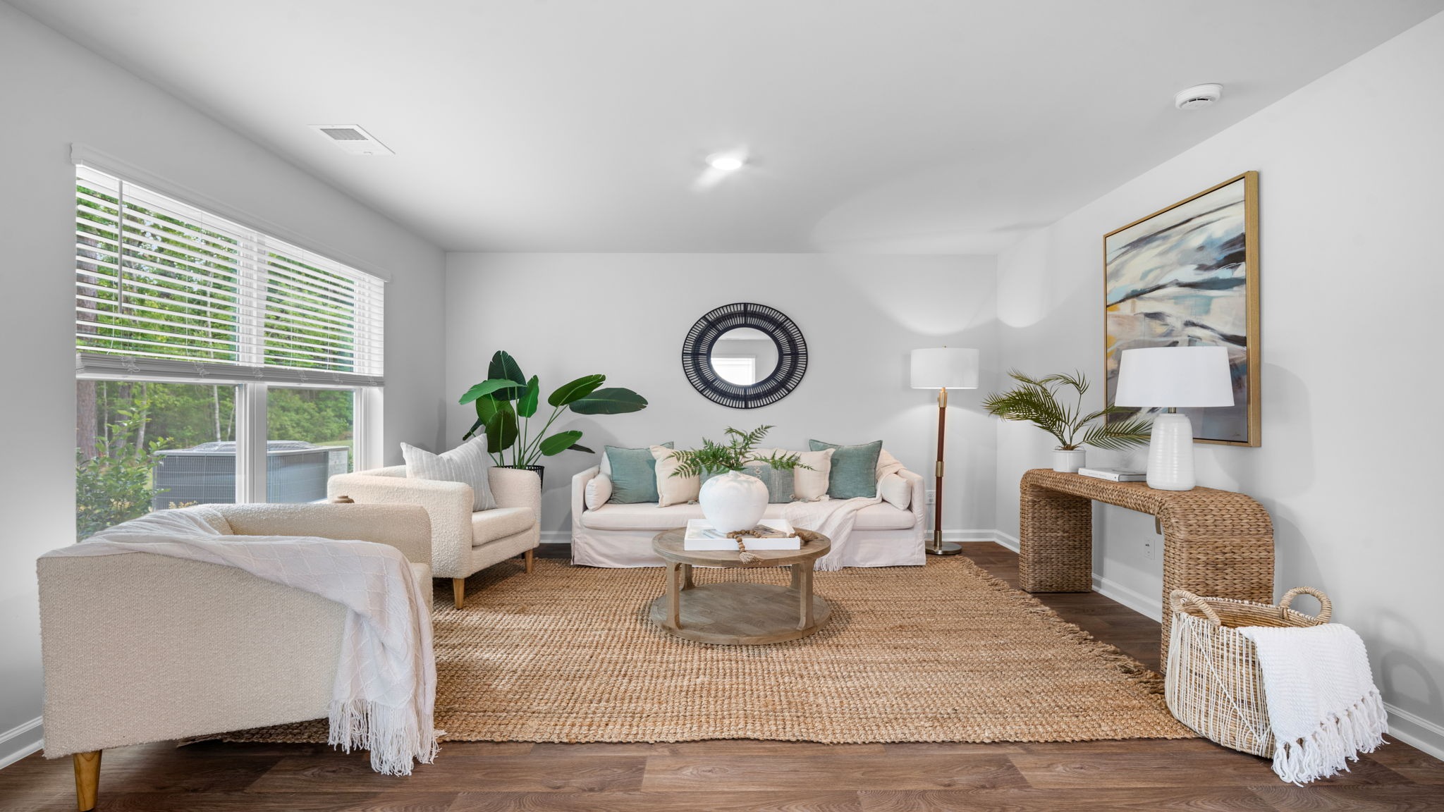 Living room decorated with a couch, chairs and tables