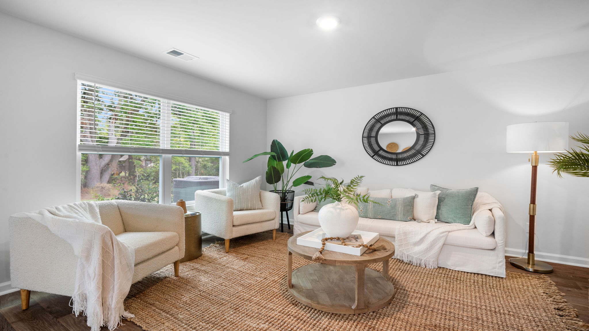 Living room decorated with a couch, chairs and tables