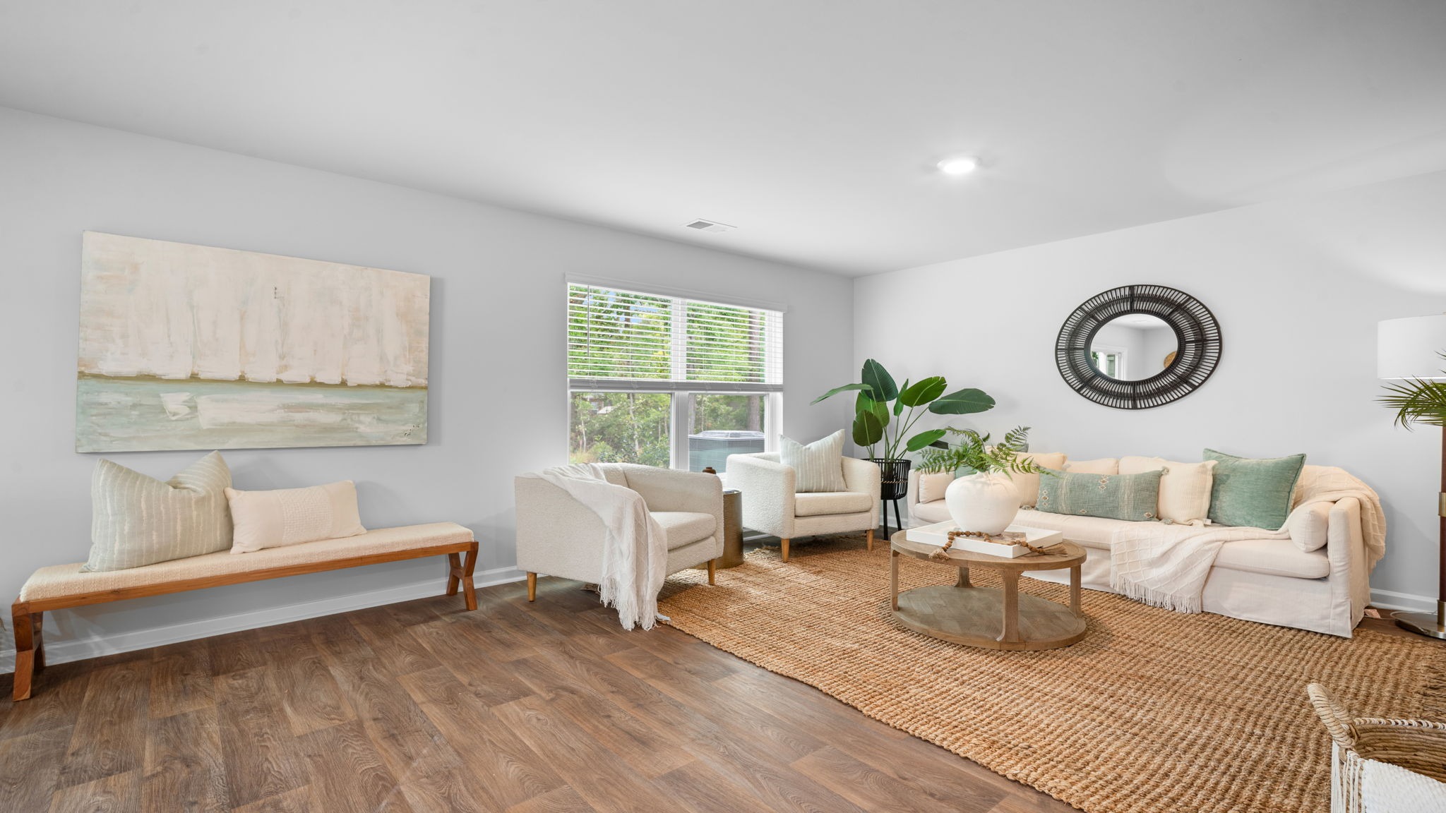 Living room decorated with a couch, chairs and tables
