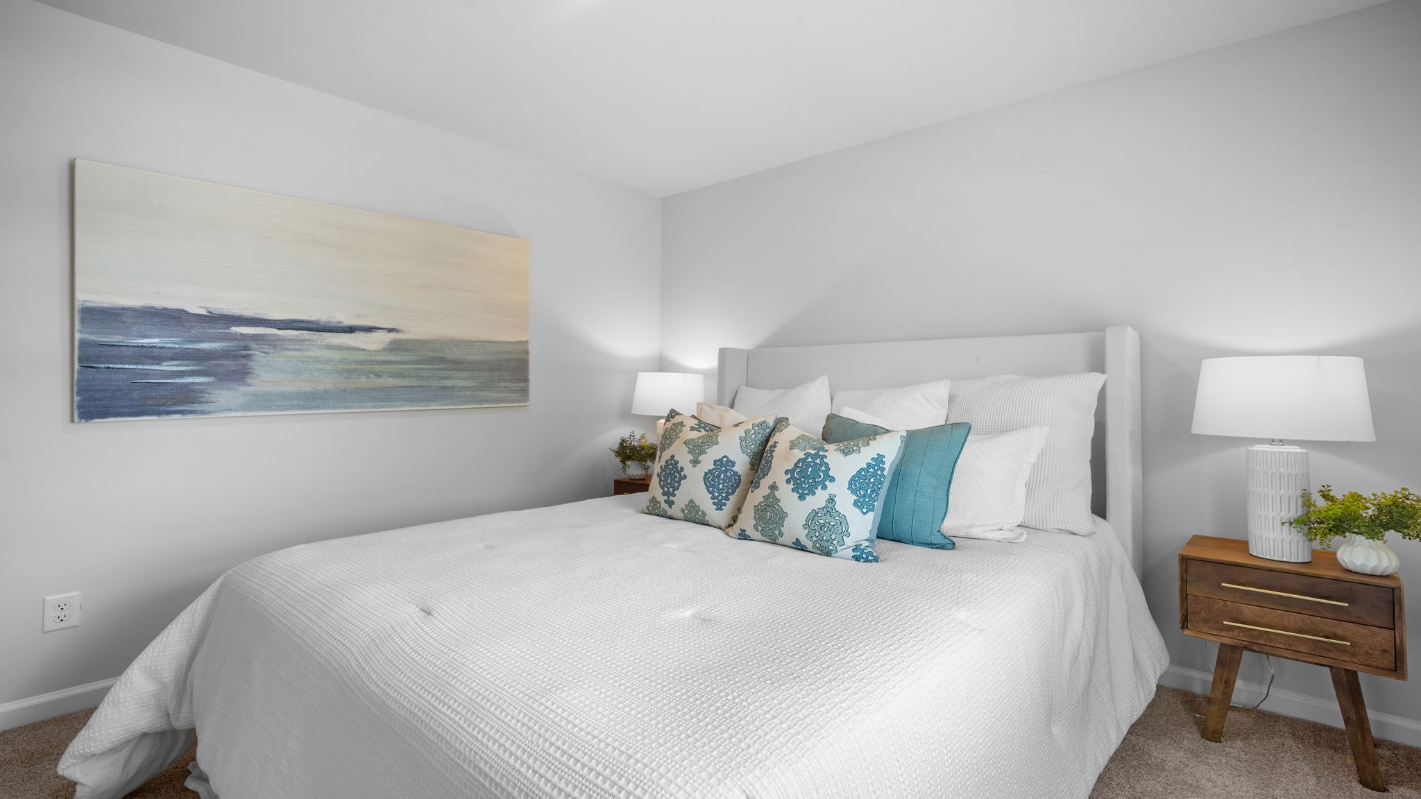 Guest bedroom view of the bed and side table