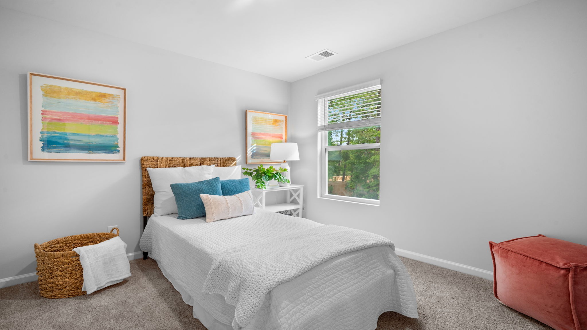 Guest bedroom decorated with a bed and a side table