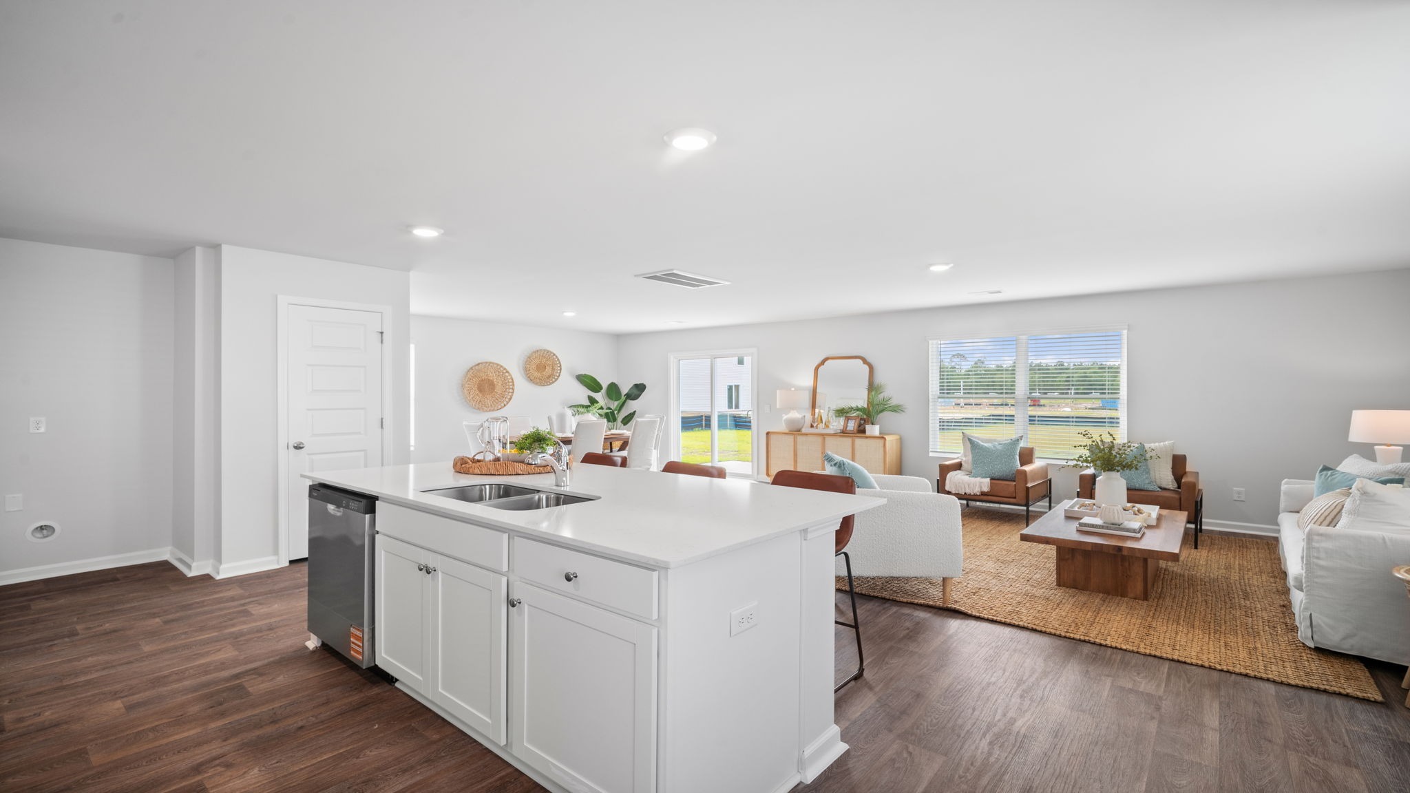 Kitchen island view of the living and dining area