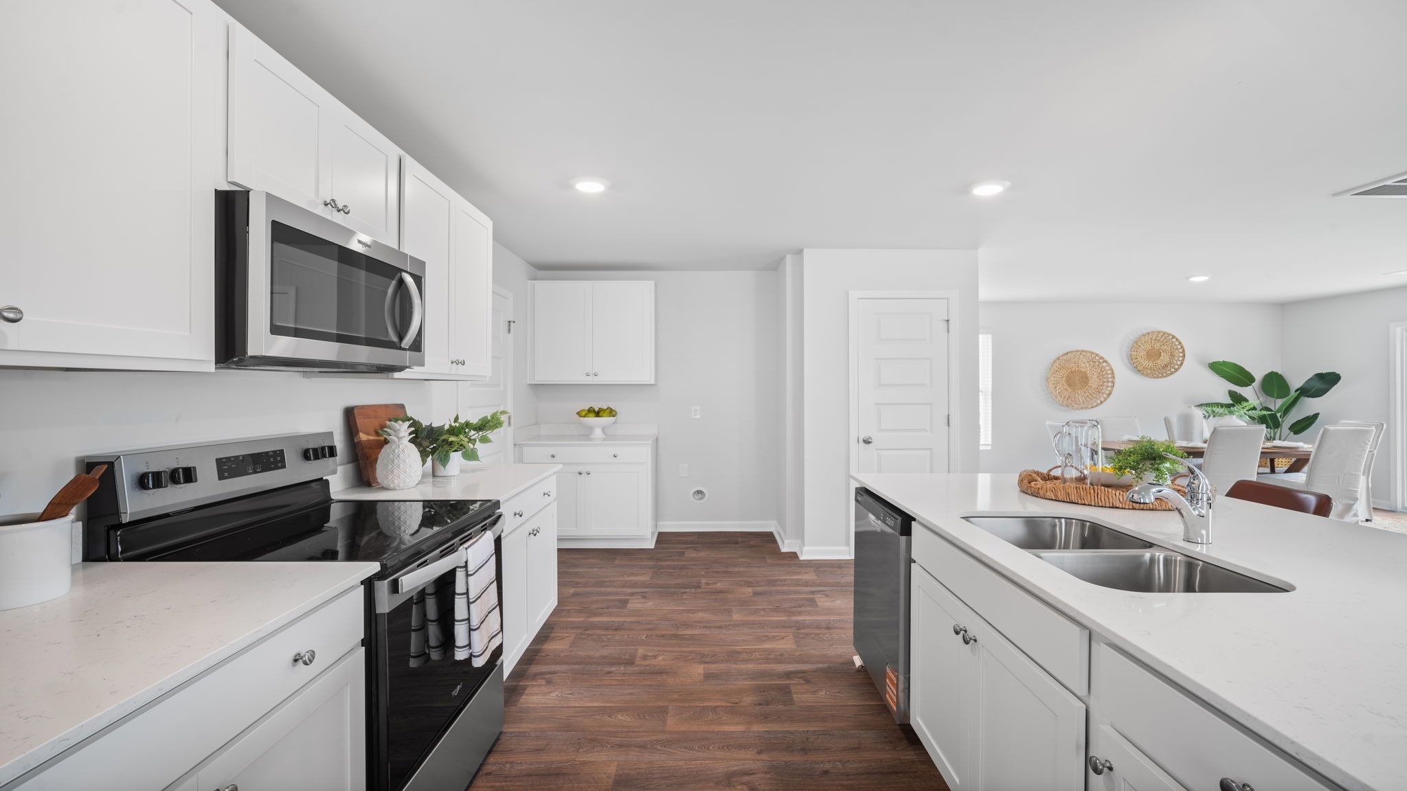 Kitchen walkway with counters on both sides