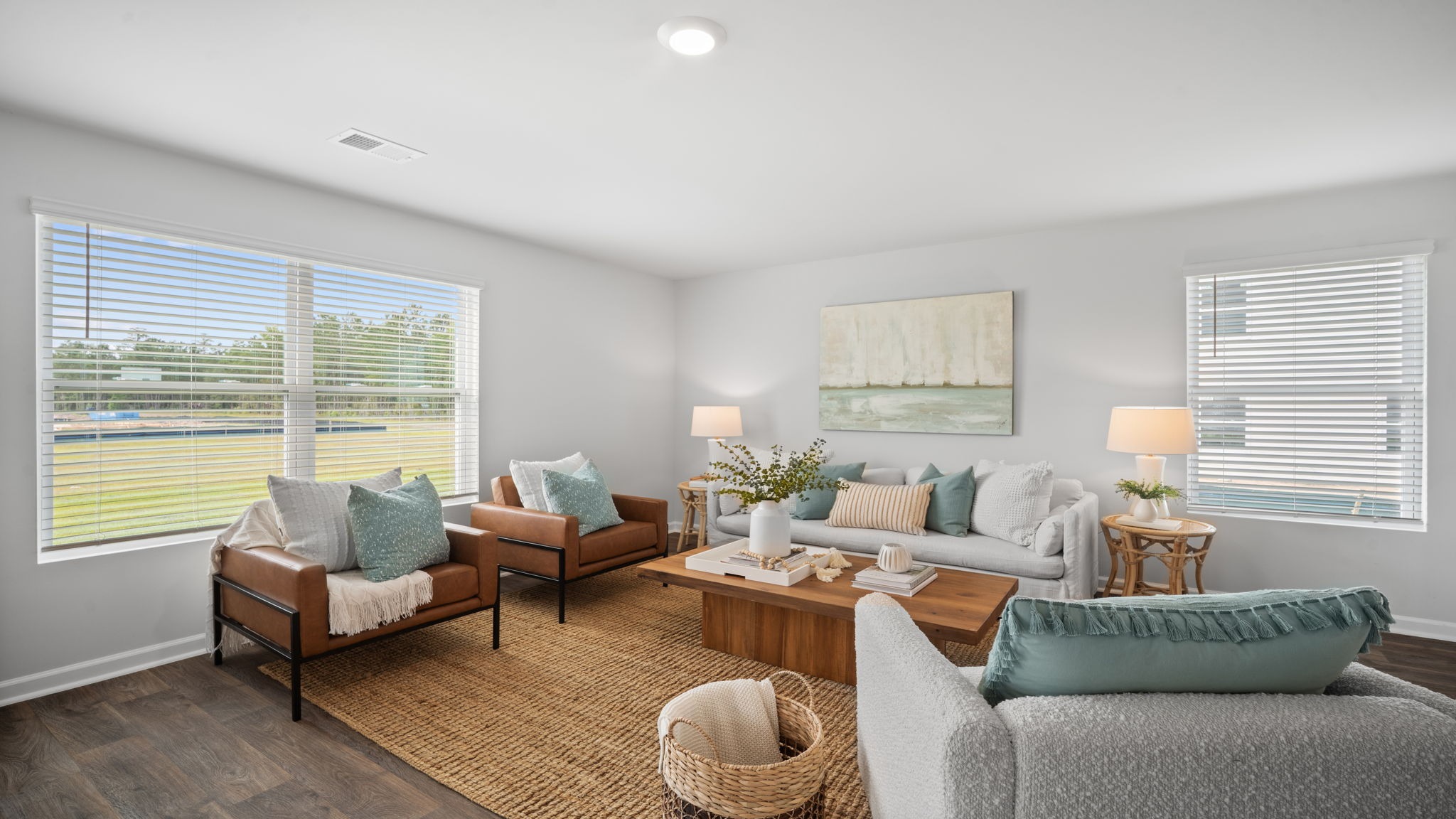 Spacious living area with large windows for natural lighting.