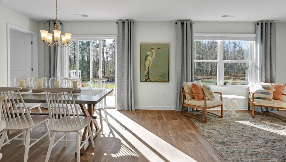 "Spacious dining room in the Macon home offering easy access to the kitchen and living room for effortless entertaining."