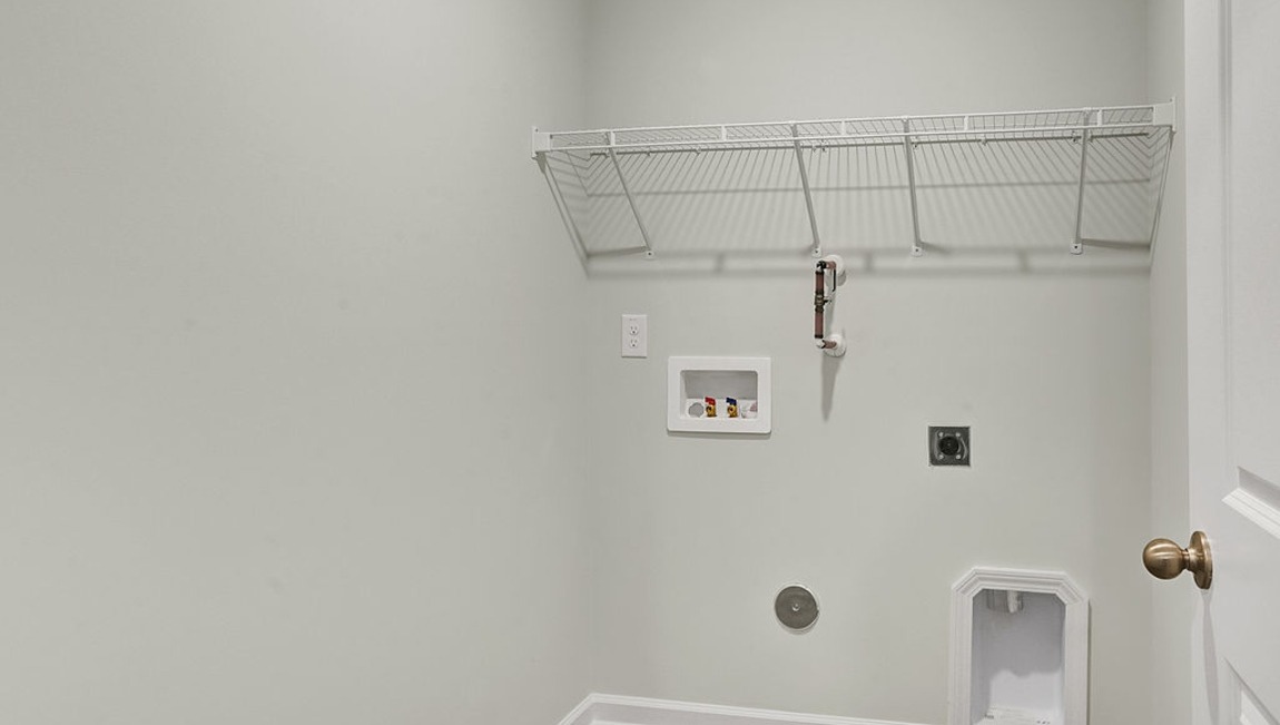 "Functional laundry area in the Macon floor plan offering convenience and efficiency for everyday living."