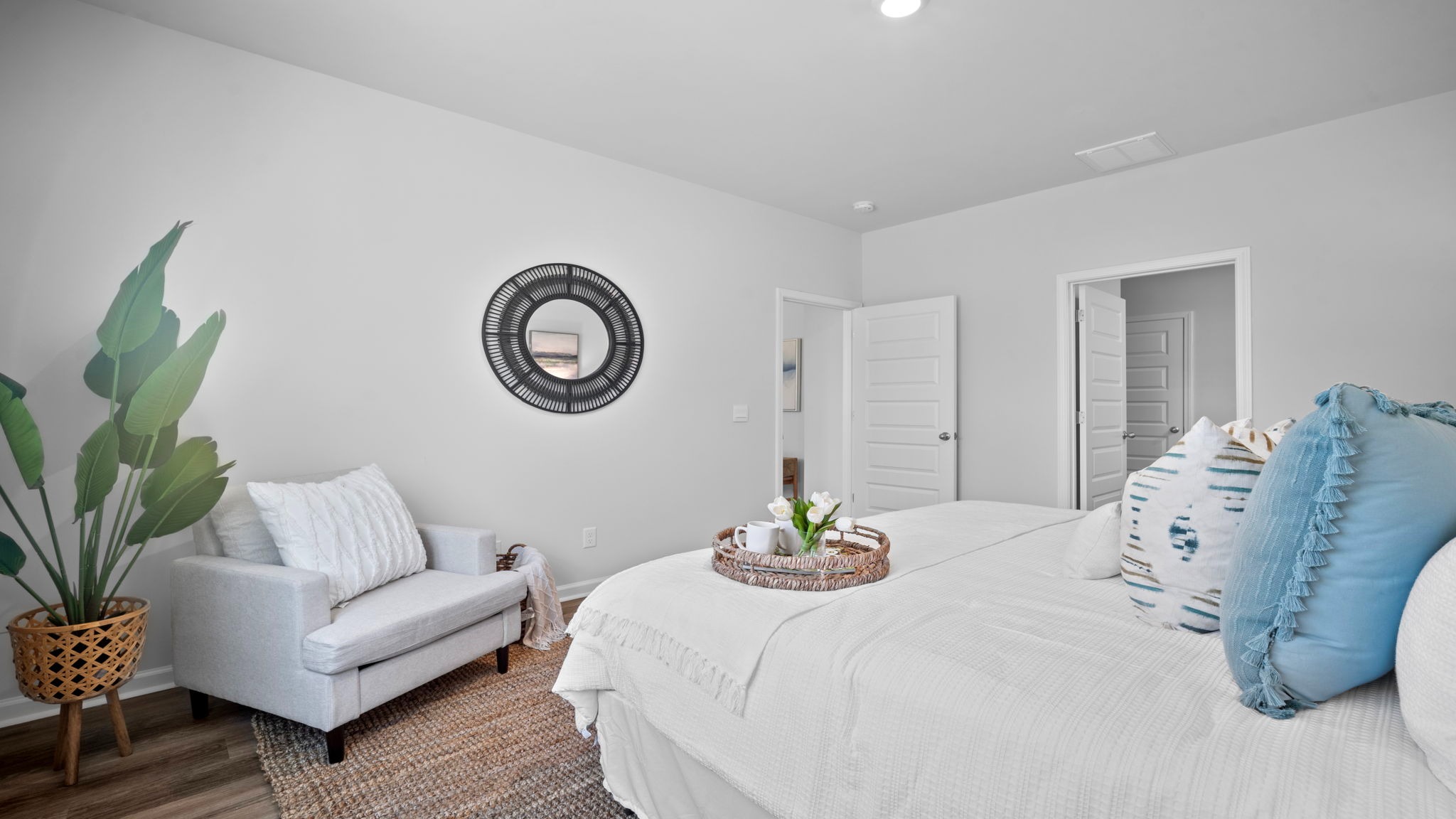 Primary bedroom with walk-in closet and easy access to the en-suite bathroom.