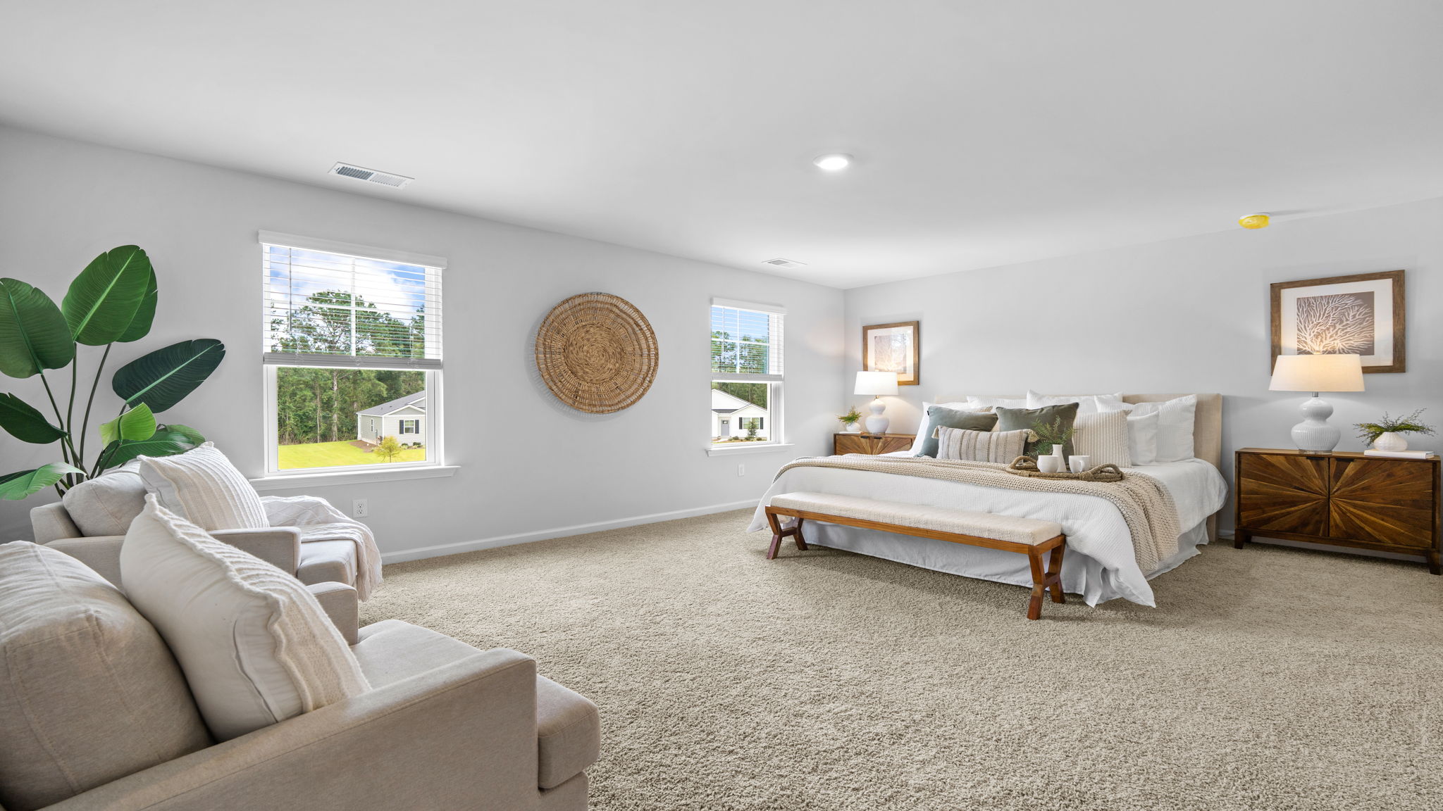 Private primary suite in the Belhaven floorplan at Holly Oaks featuring a spacious layout, large windows, walk-in closet access, and a relaxing retreat-like atmosphere.