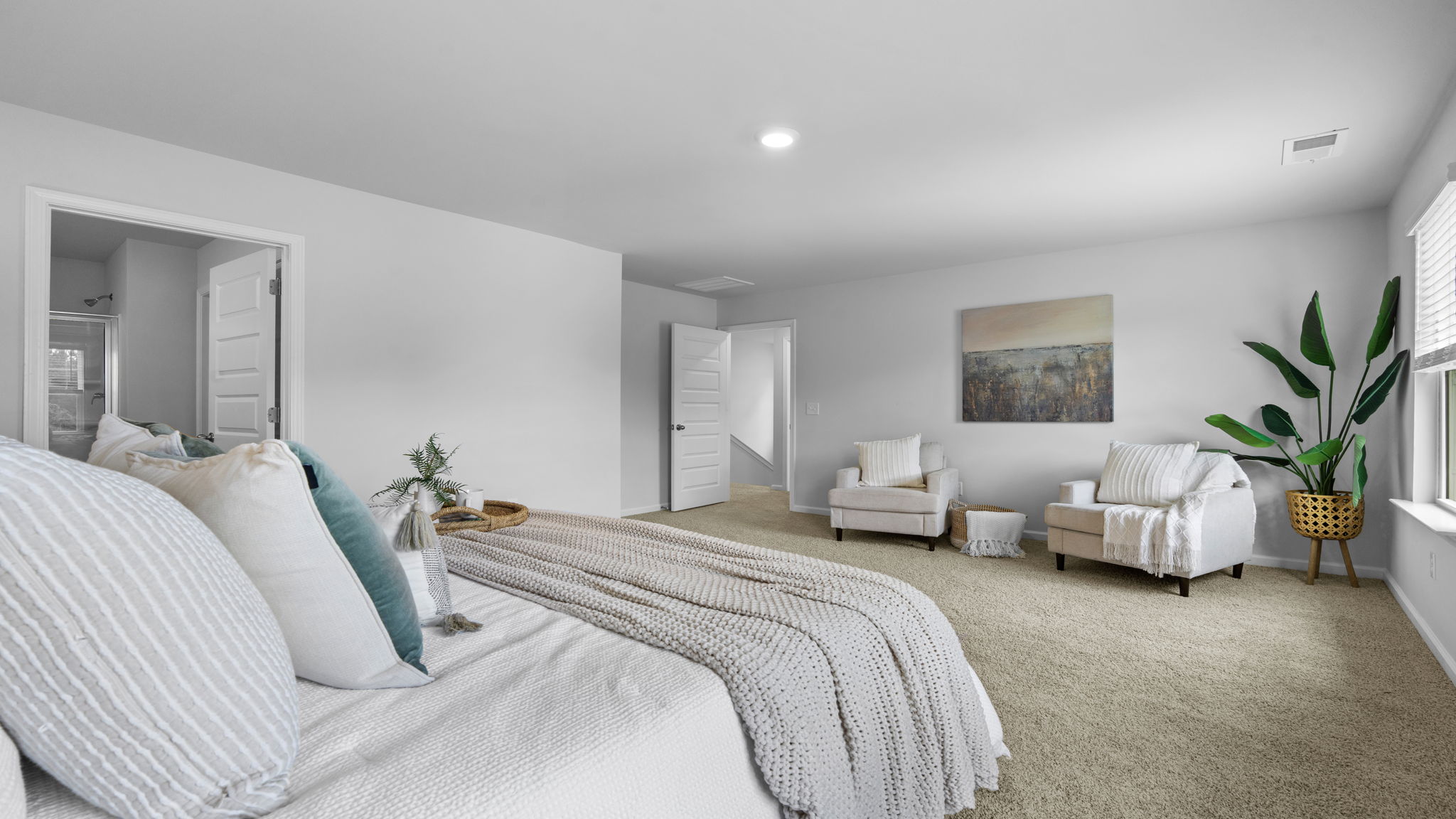 Spacious primary bedroom in the Belhaven floorplan featuring modern finishes, comfortable living space, and a thoughtfully designed layout for relaxation and privacy.