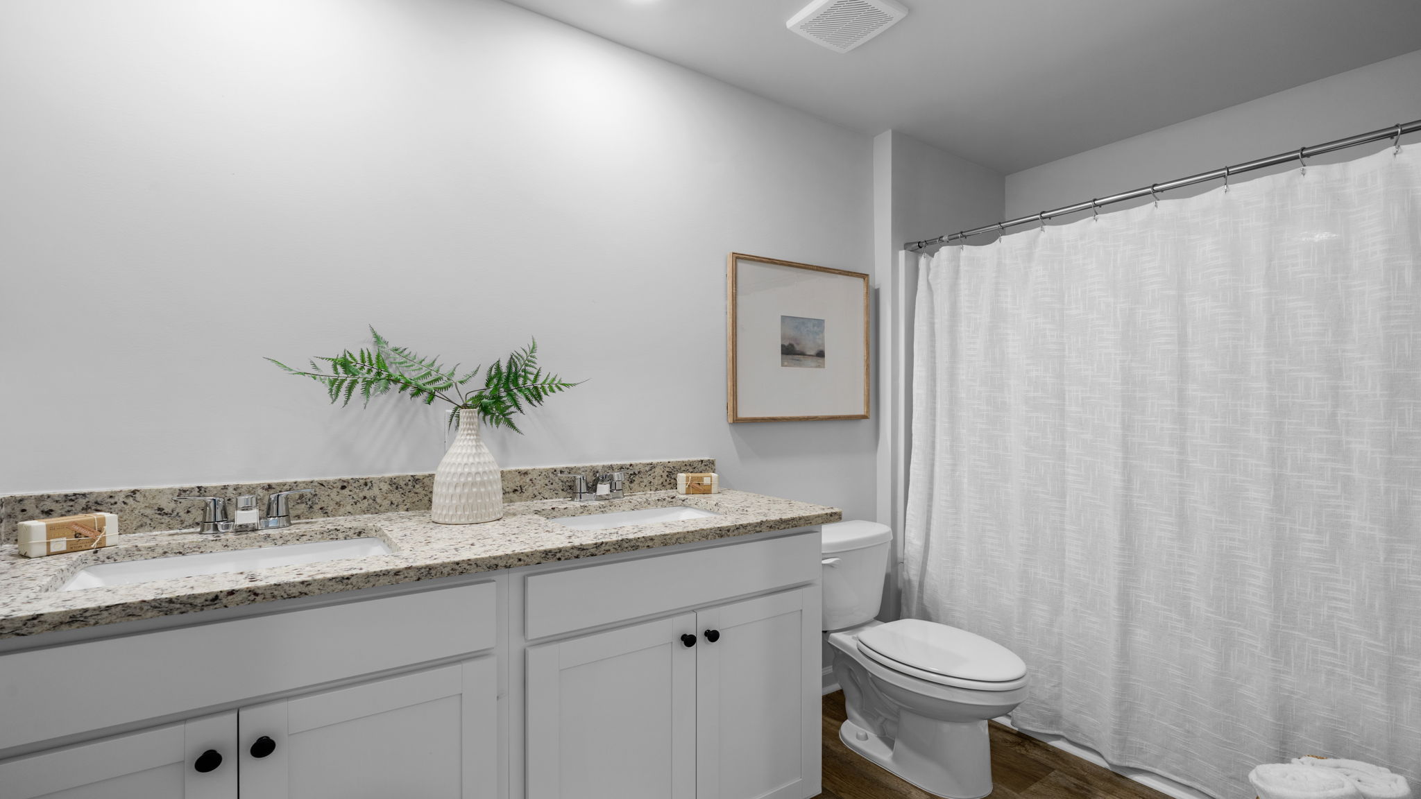 Well-designed bathroom in the Belhaven home at Holly Oaks showcasing contemporary finishes, durable surfaces, and functional everyday convenience.