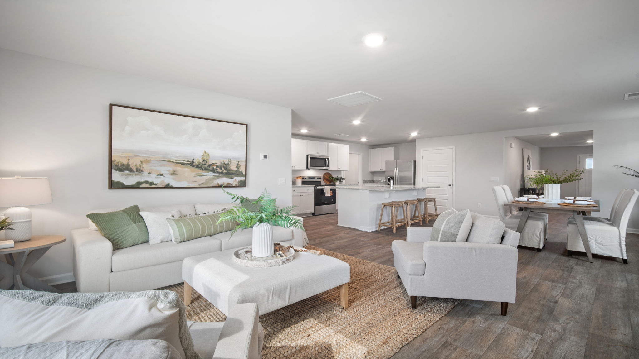 Living area with kitchen and dining area in the back.