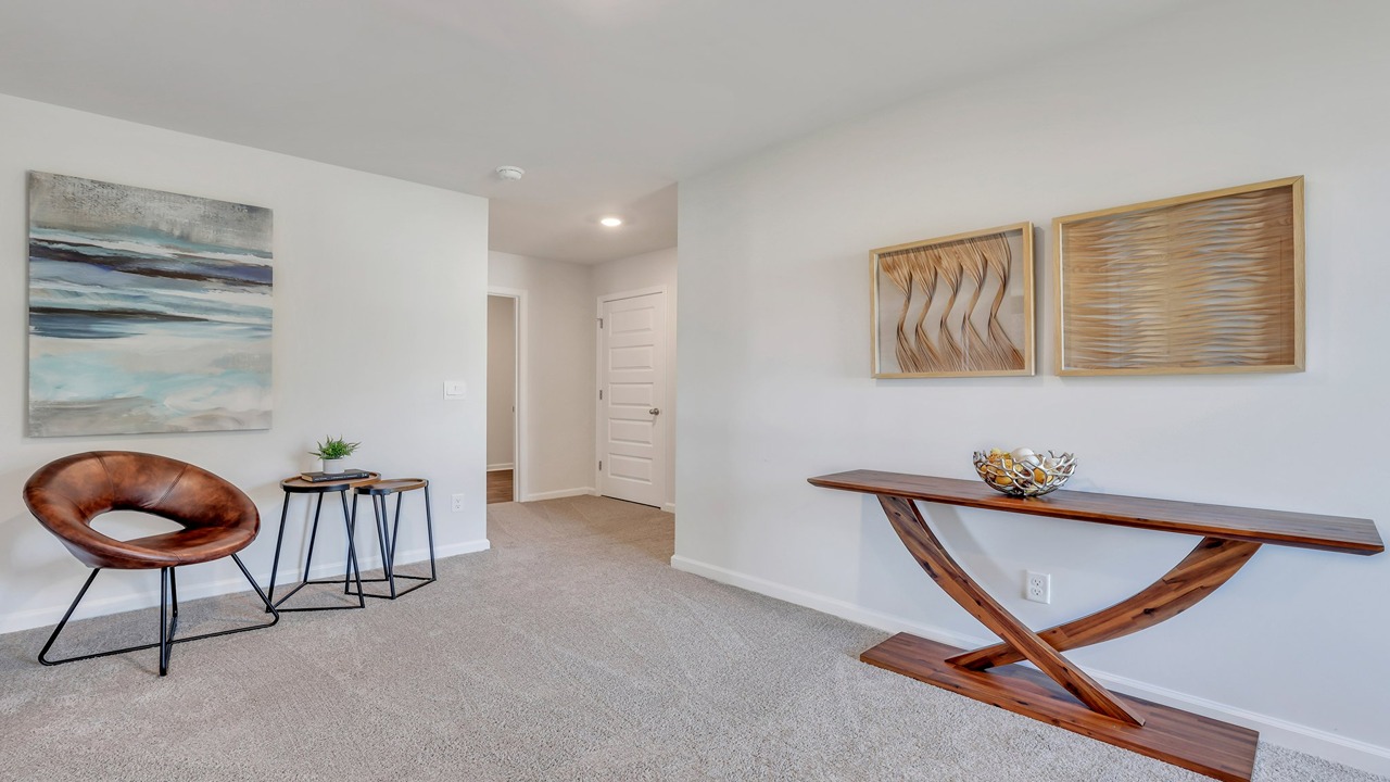 Upstairs loft with a table and chair