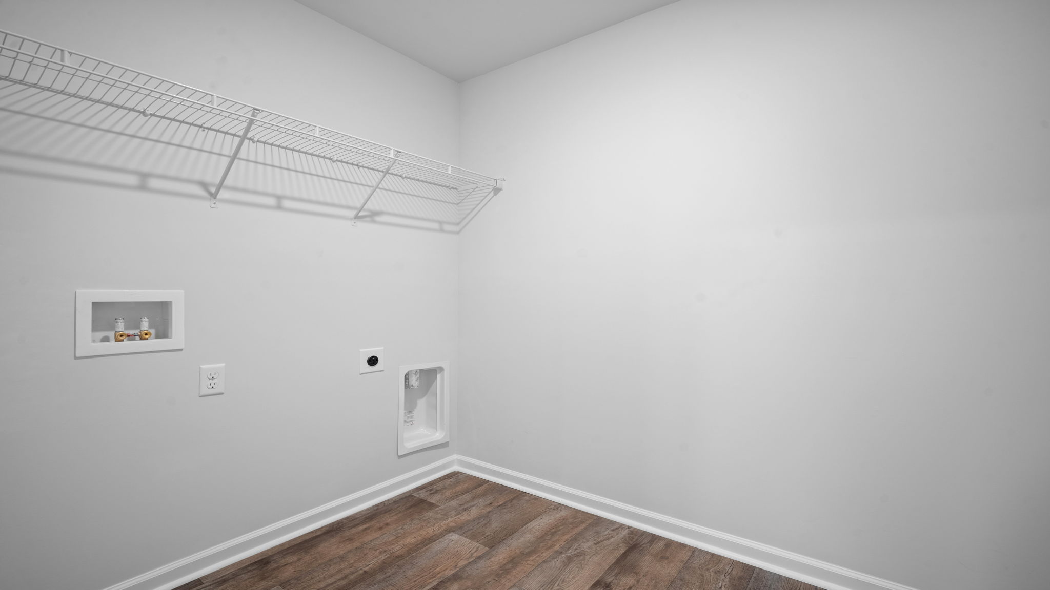 Spacious walk in closet with built in shelving in the primary bathroom.