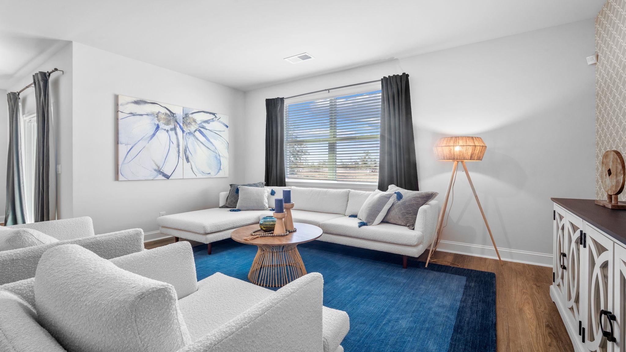 Living room decorated with seating and tables