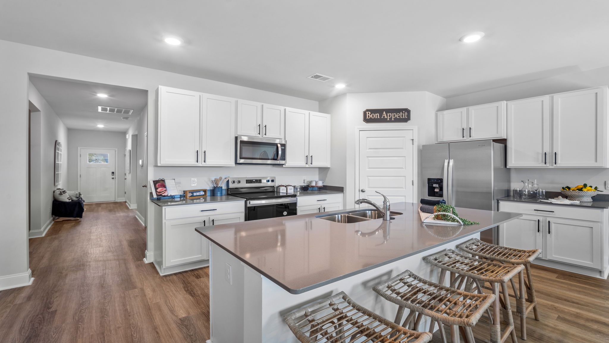 Kitchen walkway with counters on both sides