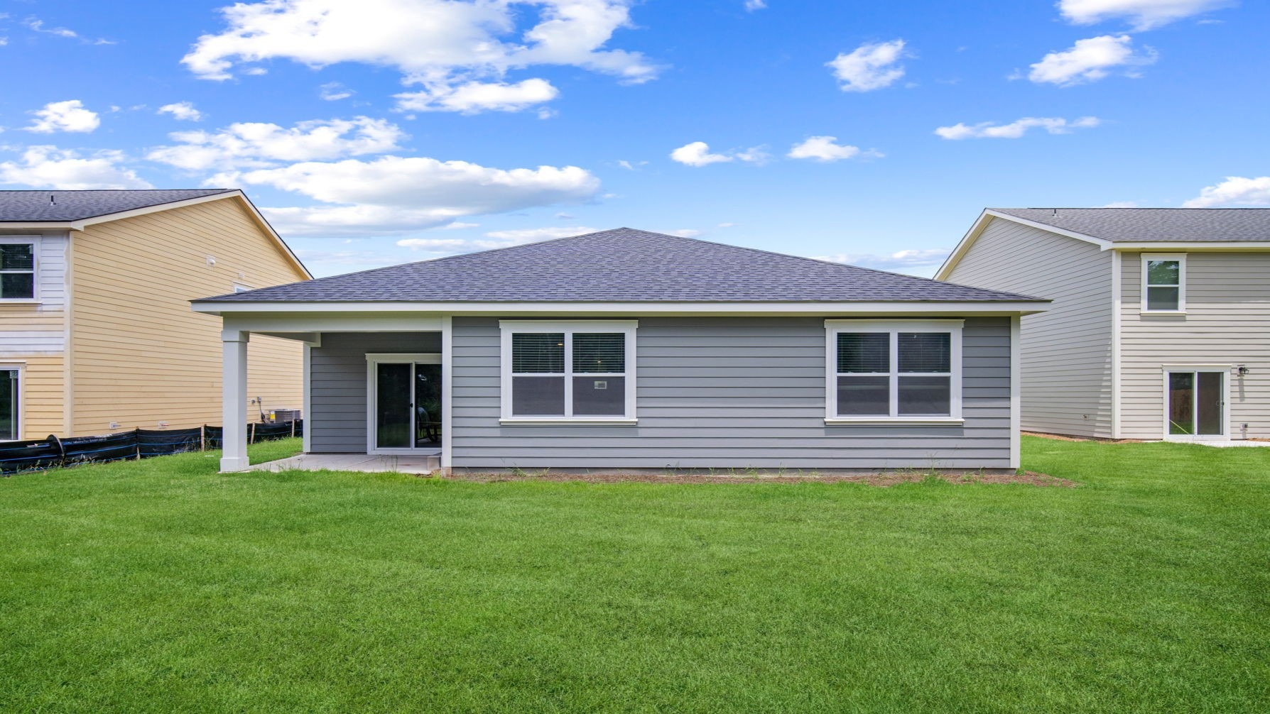 rear of home with covered patio
