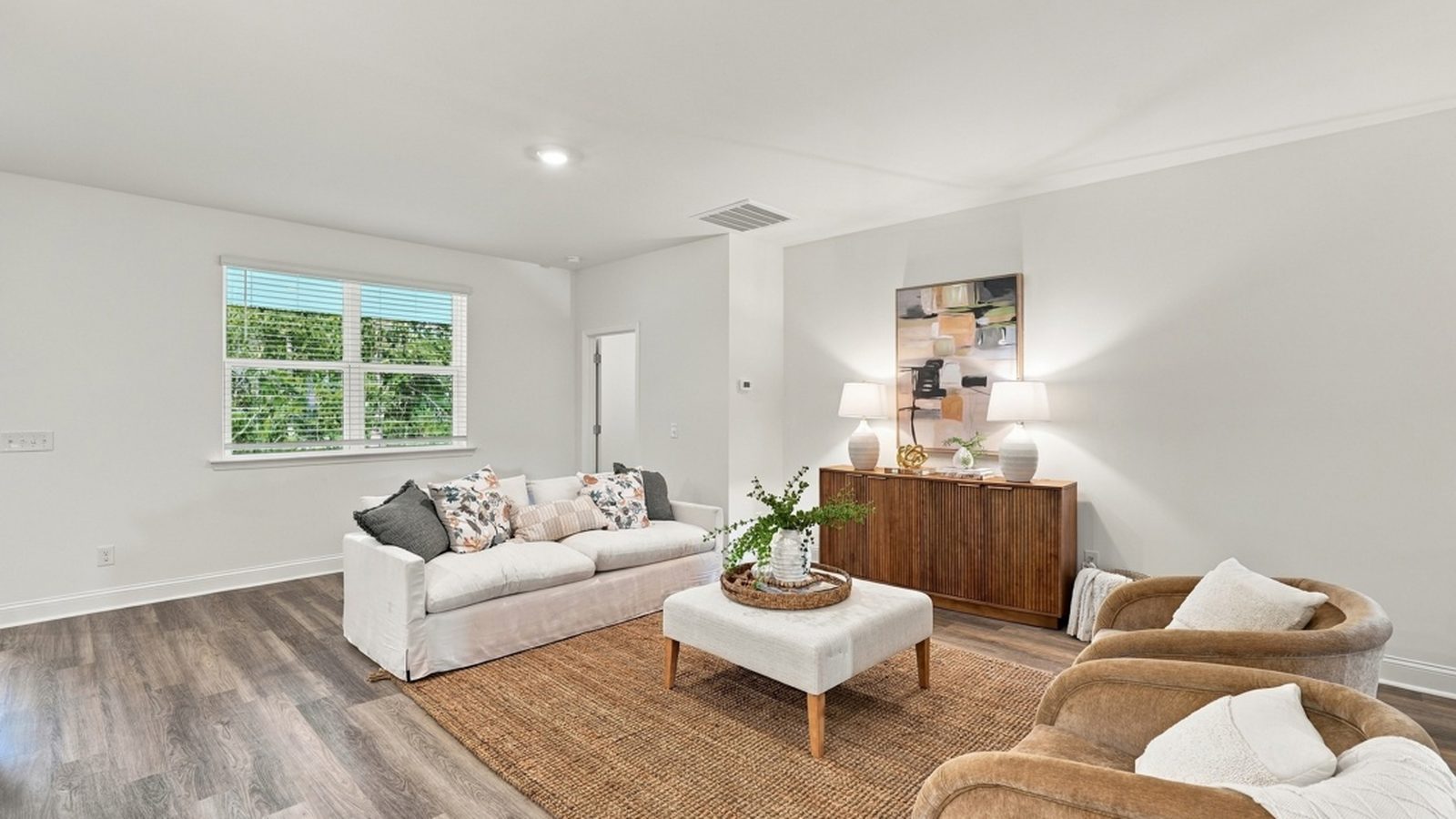 Spacious living room with natural light, modern finishes, and open-concept design perfect for entertaining.
