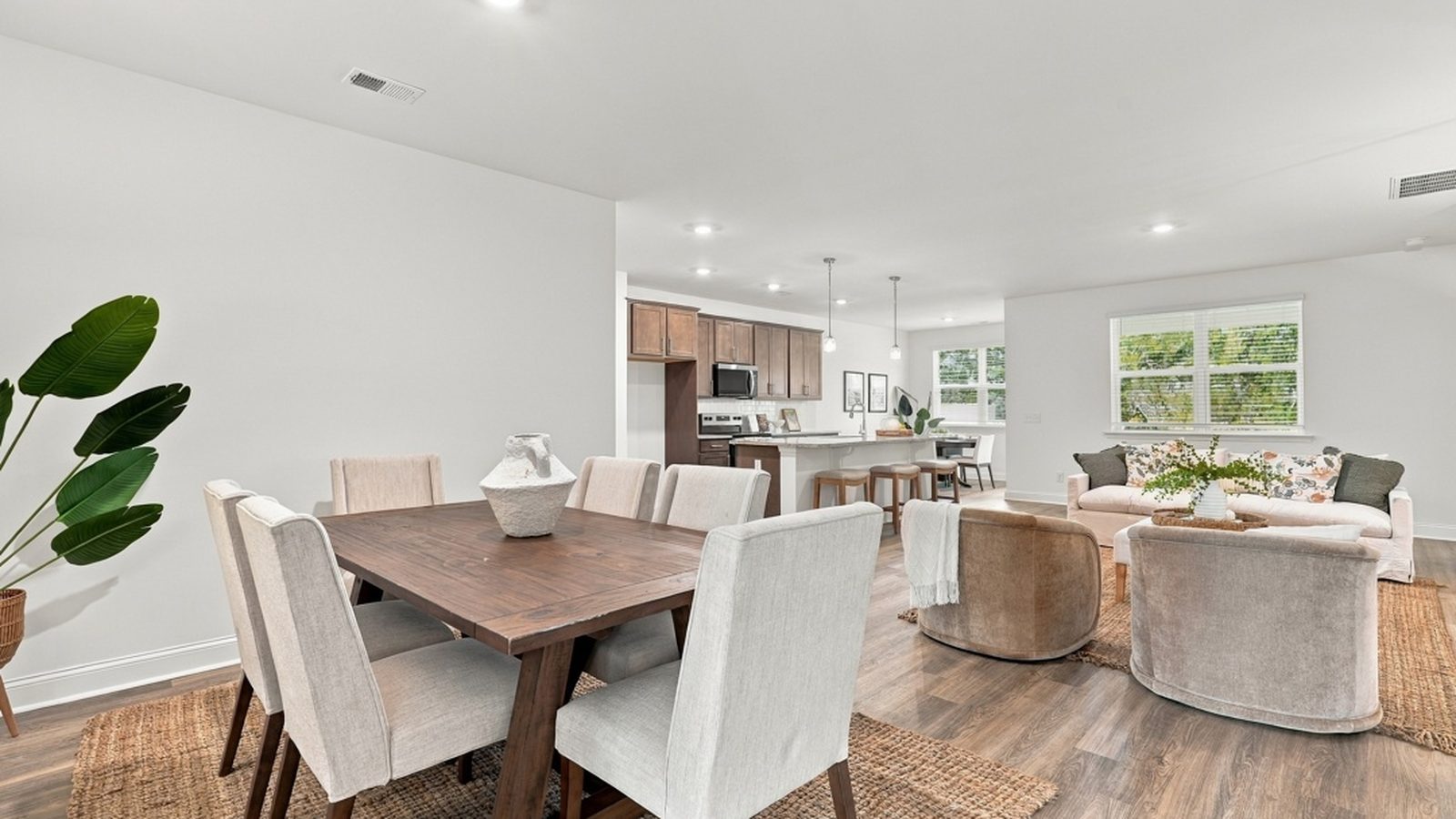 Open dining room flowing into the family room, offering flexible space for everyday living and special occasions.