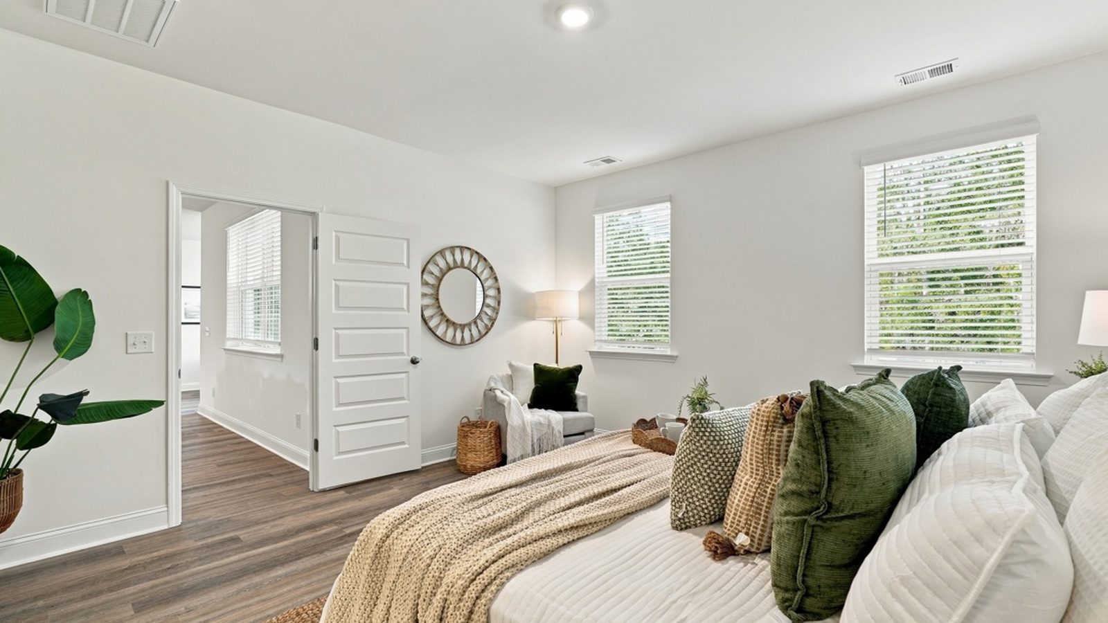 Alternate view of the primary suite showcasing generous square footage and a relaxing retreat atmosphere.