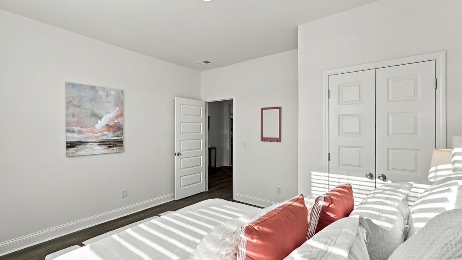 Alternate view of secondary bedroom showcasing comfortable accommodations and versatile layout.