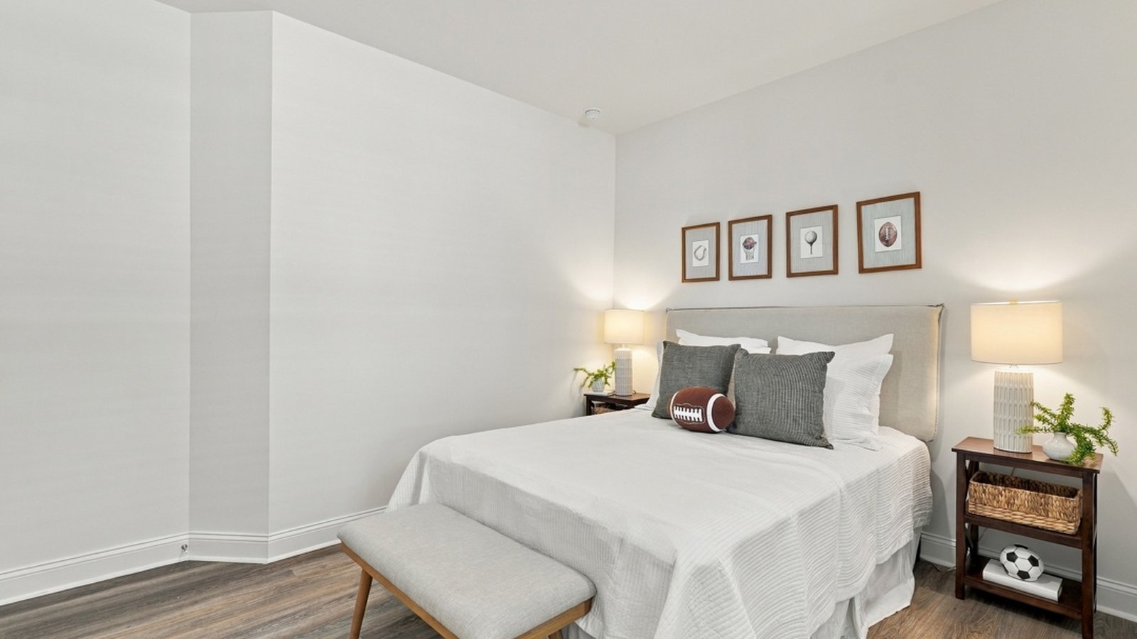 Alternate angle of the secondary bedroom highlighting room size and functionality.