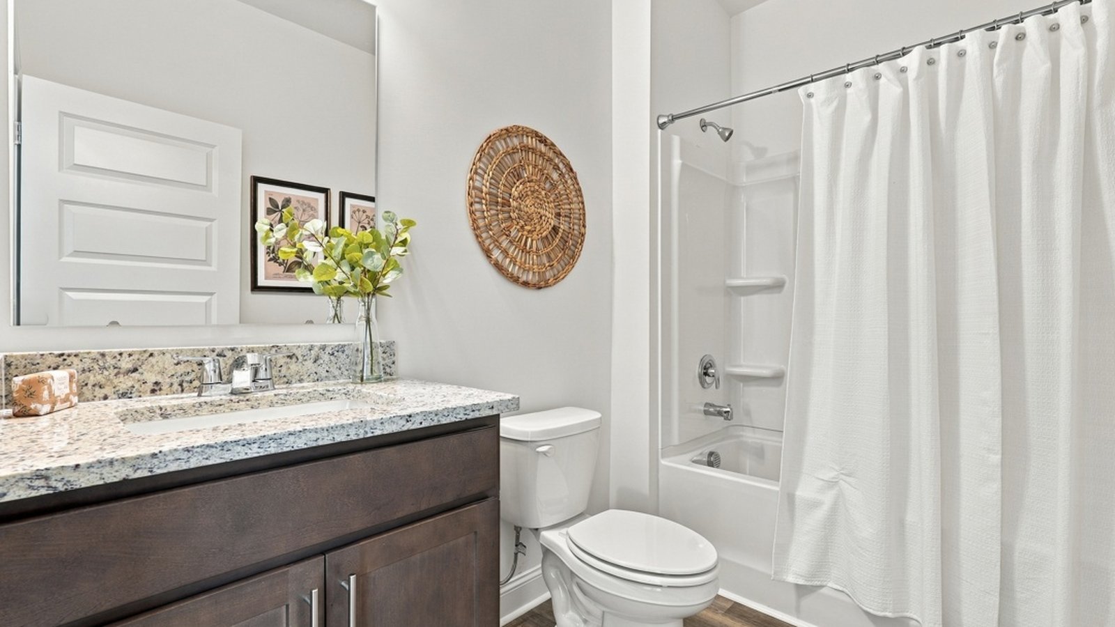 Secondary full bathroom featuring a vanity, tub-shower combination, and contemporary finishes.