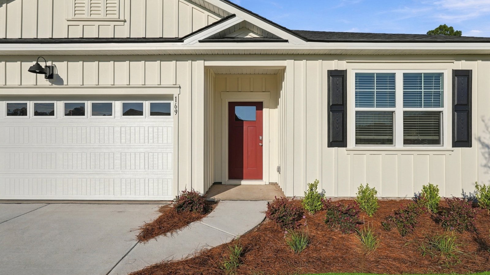Welcoming covered front porch with attractive architectural detailing and enhanced curb appeal.