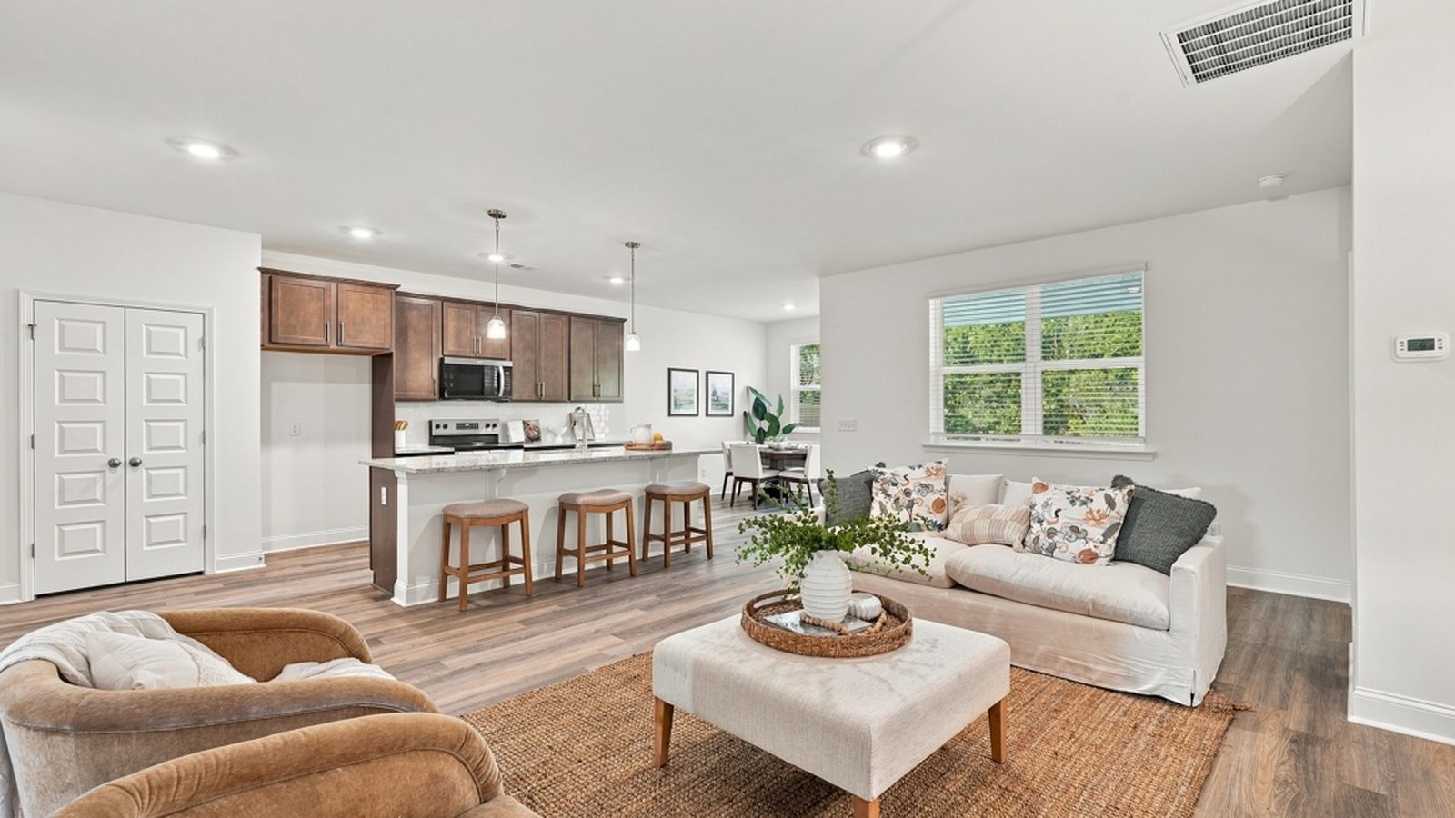 Open family room with direct connection to the kitchen, creating a spacious and welcoming gathering space