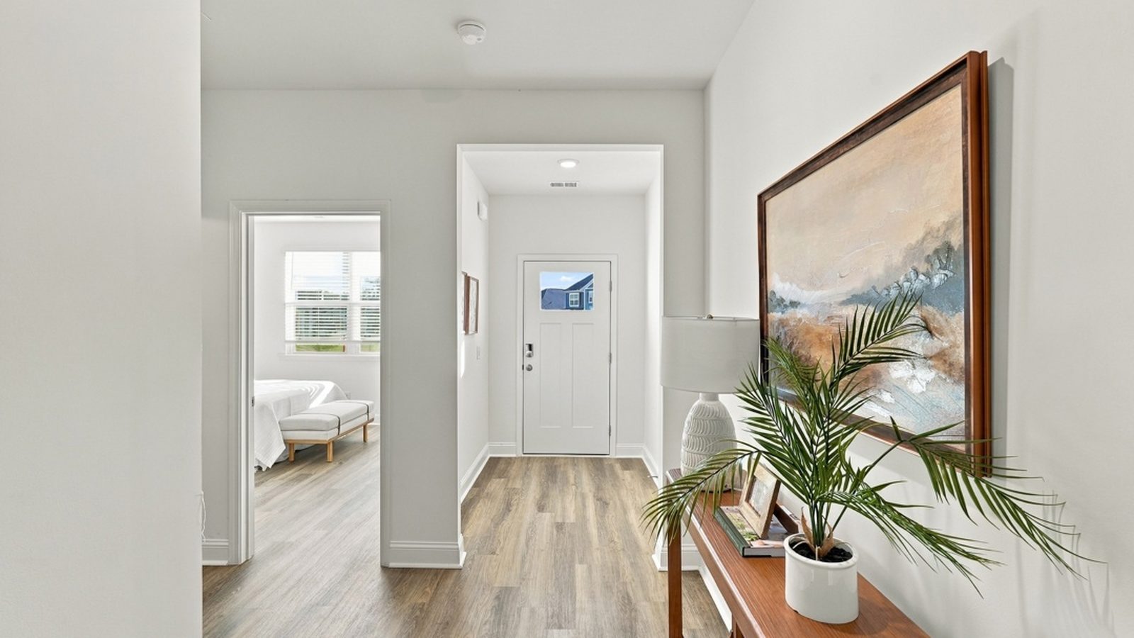 Welcoming foyer entrance with durable flooring and an inviting view into the open-concept living areas.