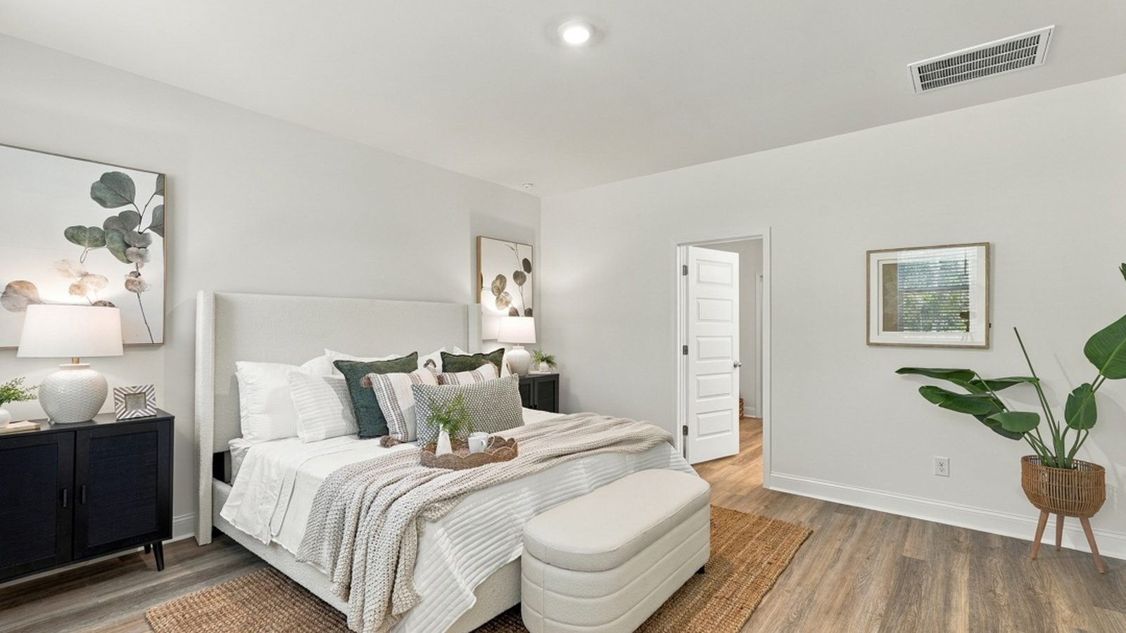 Bright primary bedroom retreat with open layout and convenient access to the ensuite bathroom and walk-in closet.