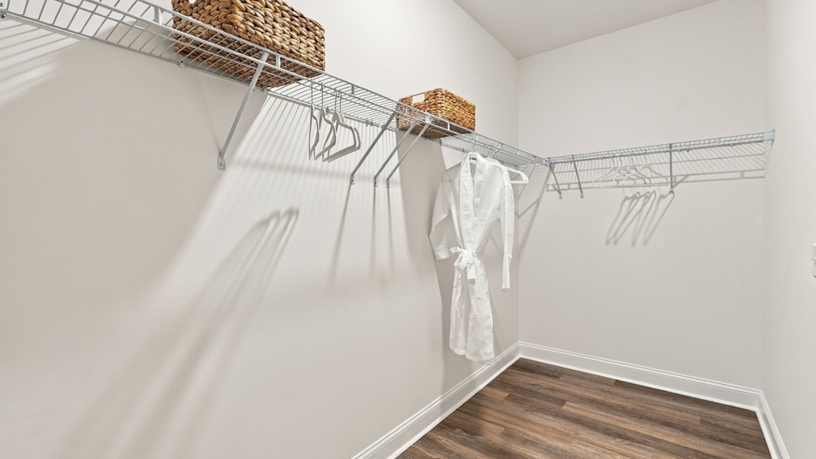 Large walk-in primary closet offering extensive storage and organization space.