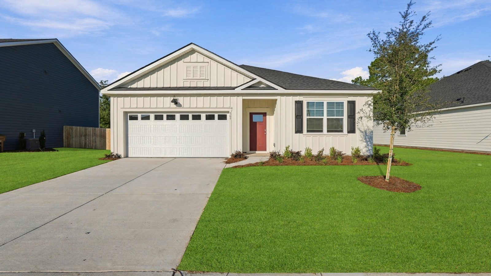 Front exterior of the Aberdeen E new construction home featuring a two-car garage, landscaped yard, and attractive curb appeal.