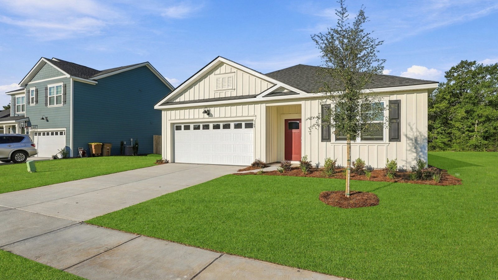 Side exterior view of the Aberdeen E home highlighting landscaping, architecture, and outdoor space.